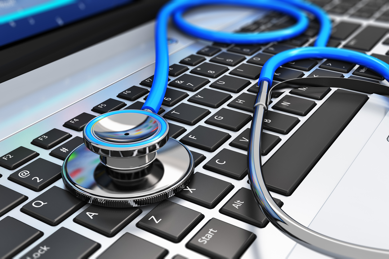 Stethoscope on a computer keyboard illustrating healthcare cybersecurity concept.